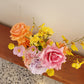Bouquet of flowers on a wooden surface with a light background