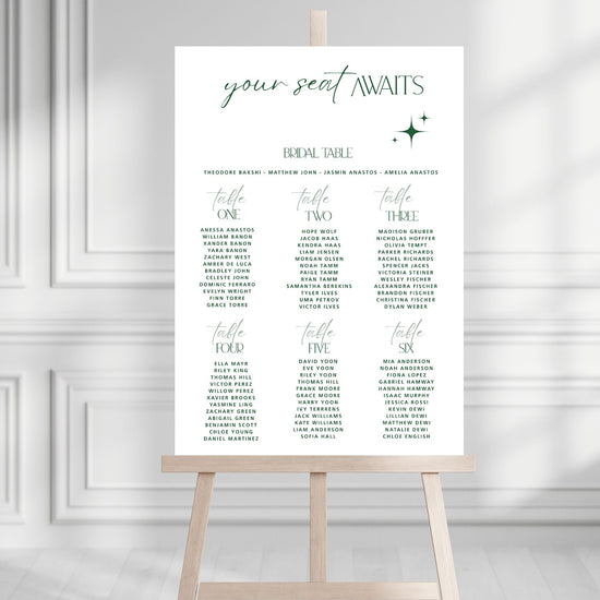Wedding seating chart on an easel against a gray wall