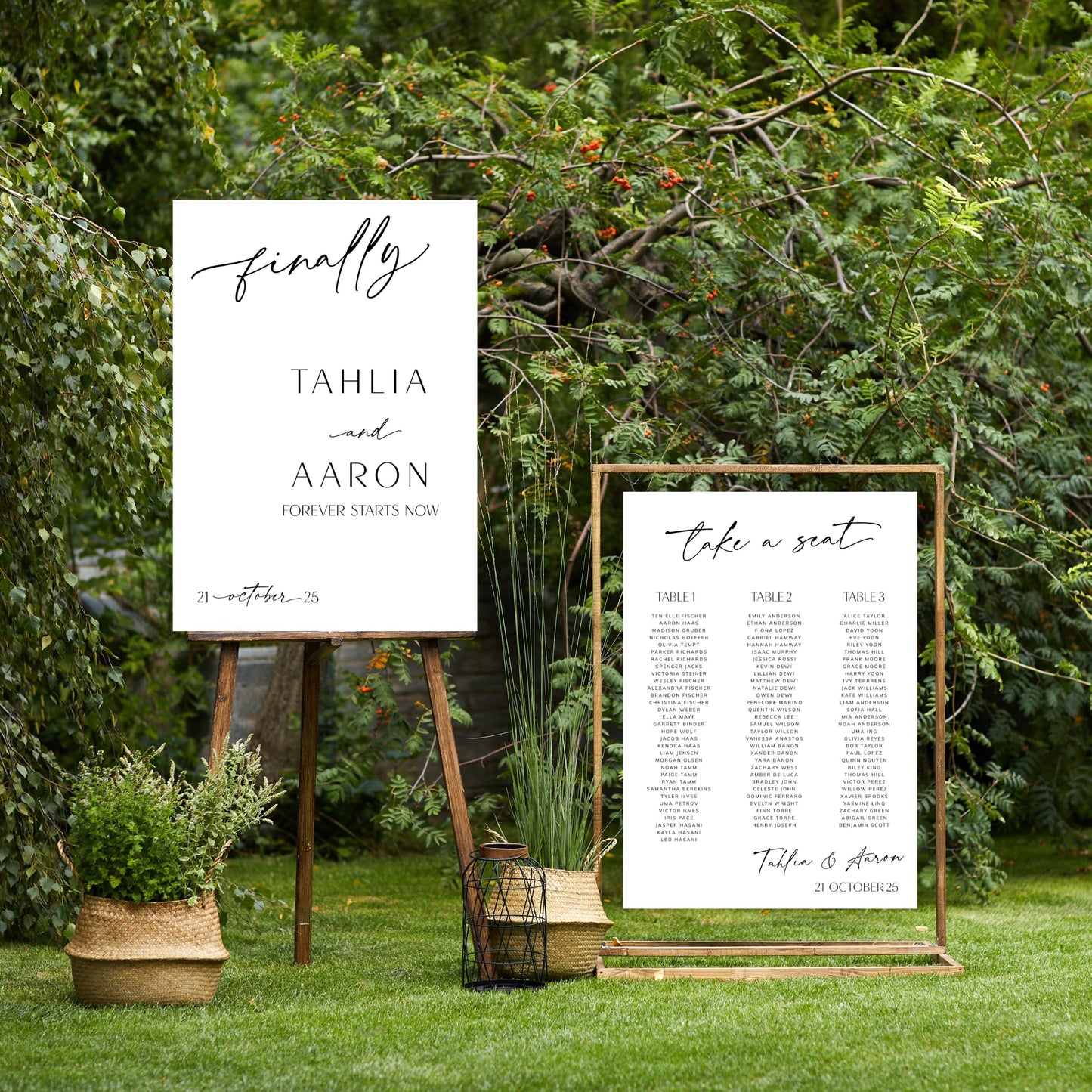 Two wedding signs on stands with greenery in the background