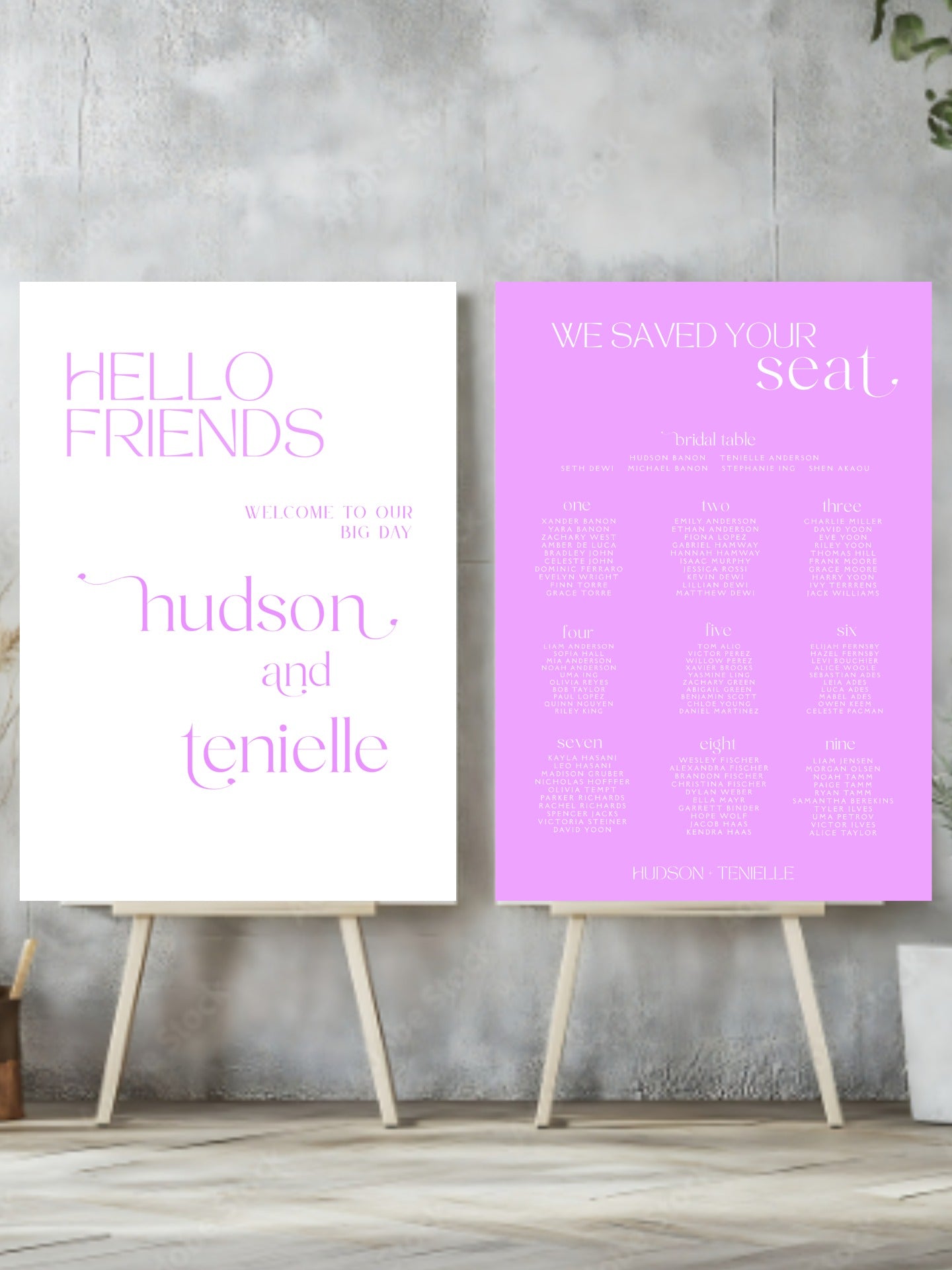 Two signs on stands with text against a gray wall.