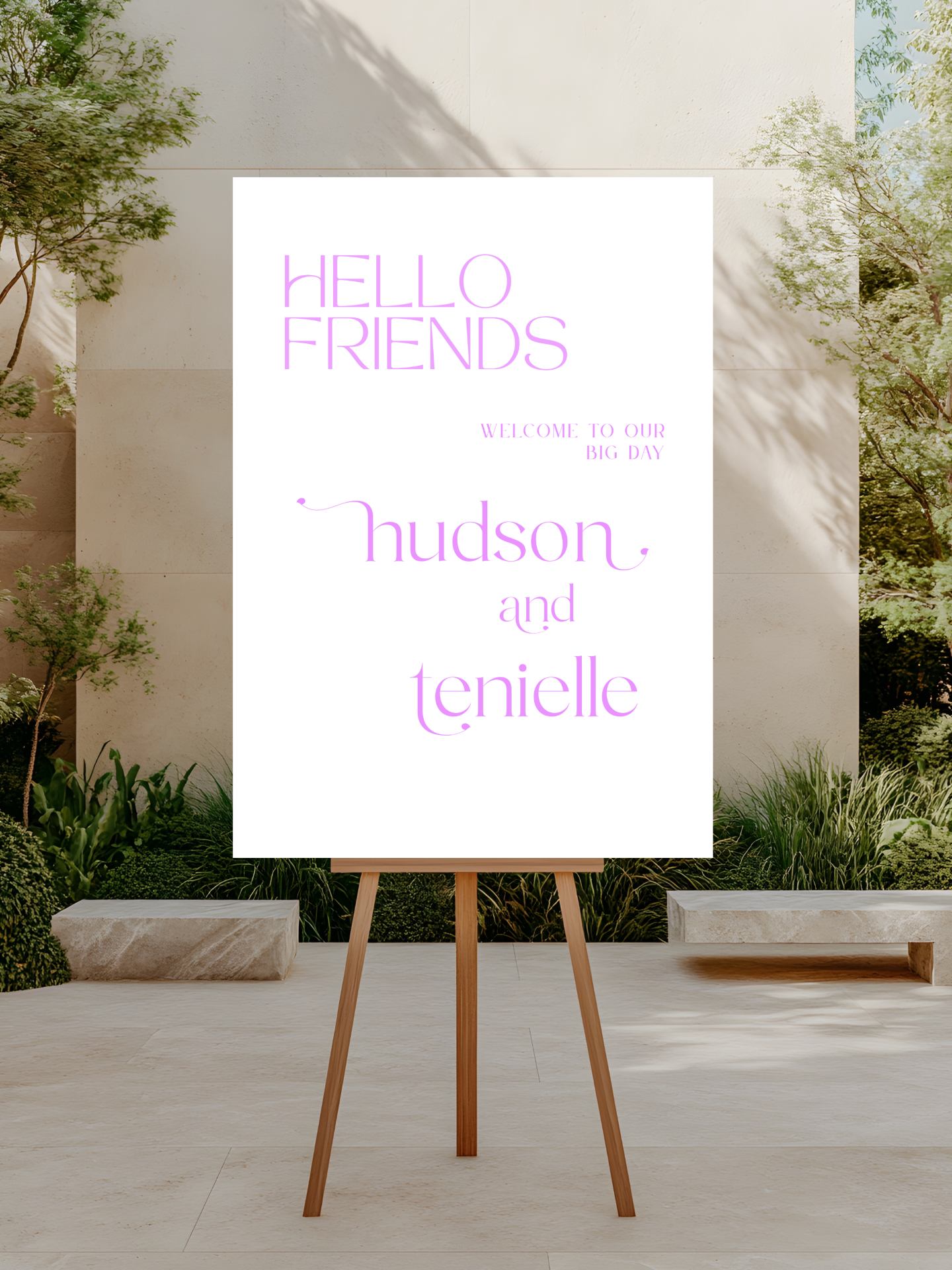 White sign with 'Hello Friends' and names on a wooden stand outdoors.