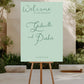 Wedding welcome sign on an easel with a garden background