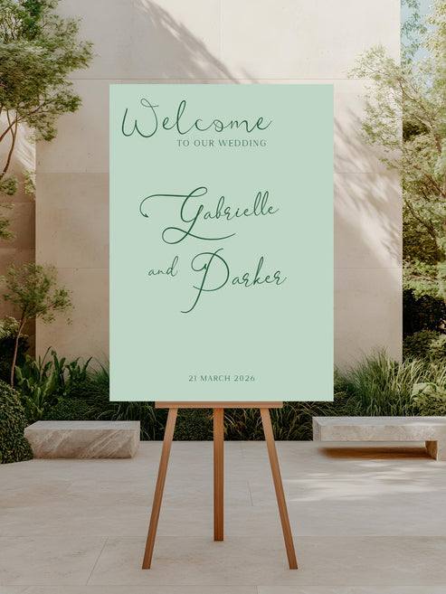 Wedding welcome sign on an easel with a garden background