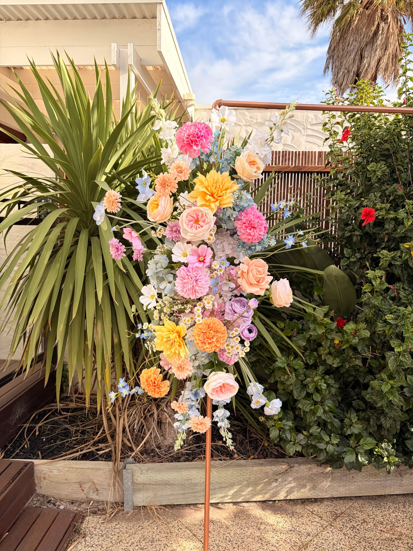 Close up of a pastel arbour arrangement for a wedding
