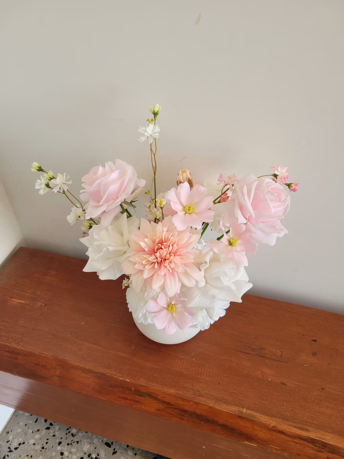 Pink and white flower arrangement with roses, cosmos and dahlias