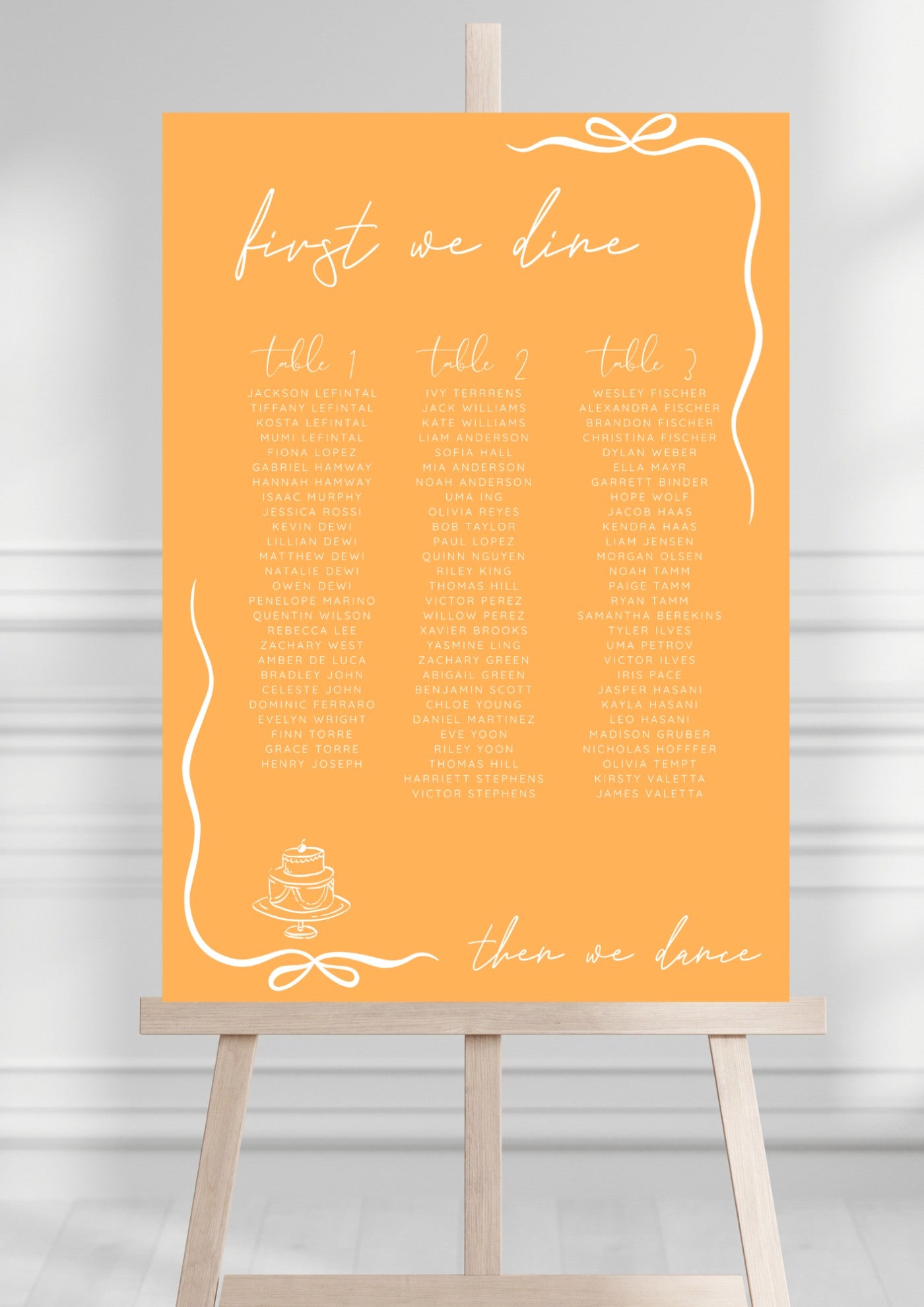 Orange wedding seating chart with text on a stand against a white background