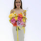 Woman holding a bouquet of colorful flowers against a white background