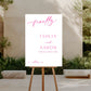 Wedding sign on an easel outdoors with a garden background